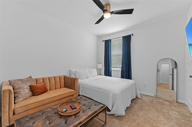 1425 Paget Cv, Sanford, FL 32771 - bedroom featuring light colored carpet, ceiling fan, arched walkways, and baseboards