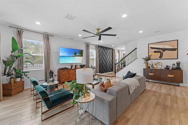 1425 Paget Cv, Sanford, FL 32771 - living room with light wood-type flooring, a ceiling fan, stairway, recessed lighting, and baseboards