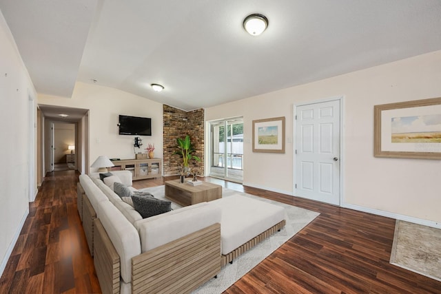 1470 Winston Rd, Maitland, FL 32751 - living area featuring vaulted ceiling, wood finished floors, and baseboards