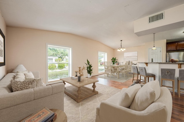 1470 Winston Rd, Maitland, FL 32751 - living area featuring light wood-style floors, lofted ceiling, and a chandelier