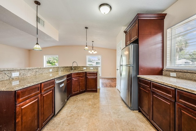 1470 Winston Rd, Maitland, FL 32751 - kitchen with appliances with stainless steel finishes, a sink, vaulted ceiling, pendant lighting, and light stone countertops