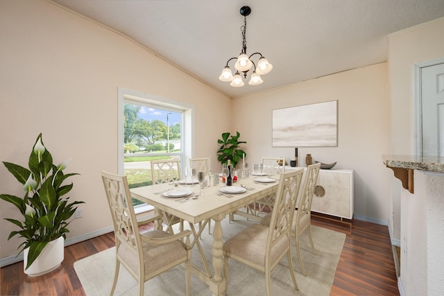 1470 Winston Rd, Maitland, FL 32751 - dining area with vaulted ceiling, a chandelier, wood finished floors, and baseboards