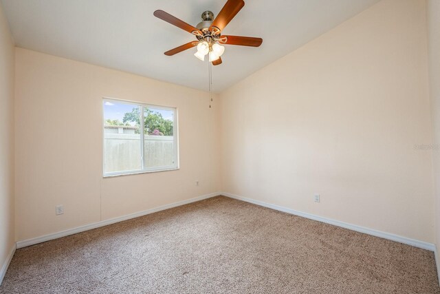 1470 Winston Rd, Maitland, FL 32751 - carpeted empty room featuring a ceiling fan, baseboards, and vaulted ceiling