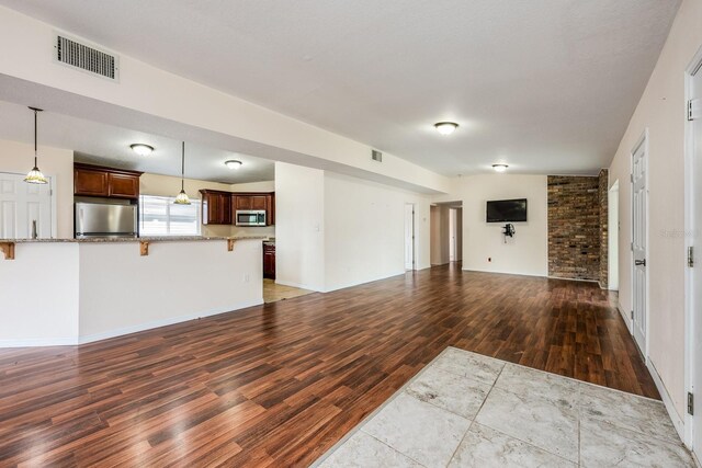 1470 Winston Rd, Maitland, FL 32751 - unfurnished living room featuring wood finished floors