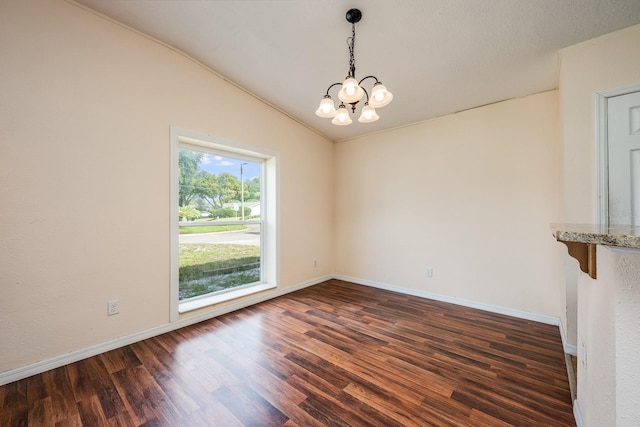 1470 Winston Rd, Maitland, FL 32751 - spare room featuring lofted ceiling, a chandelier, wood finished floors, and baseboards
