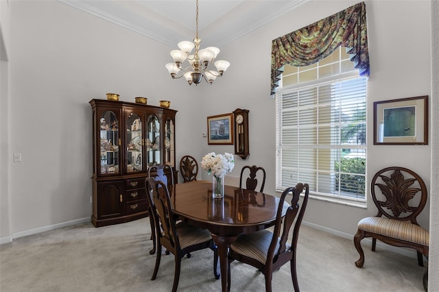 2026 Winding Oaks Dr, Orlando, FL 32825 - dining area with a chandelier, light colored carpet, crown molding, baseboards, and a high ceiling
