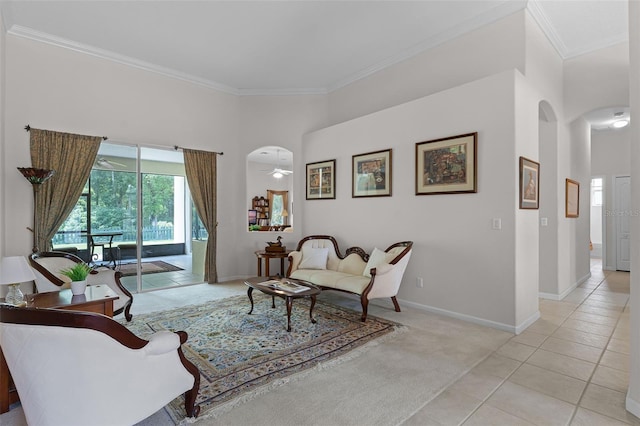 2026 Winding Oaks Dr, Orlando, FL 32825 - living room with arched walkways, ornamental molding, baseboards, light carpet, and light tile patterned flooring