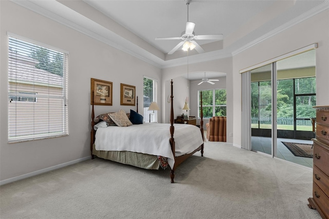 2026 Winding Oaks Dr, Orlando, FL 32825 - bedroom with access to exterior, light carpet, baseboards, ornamental molding, and a tray ceiling