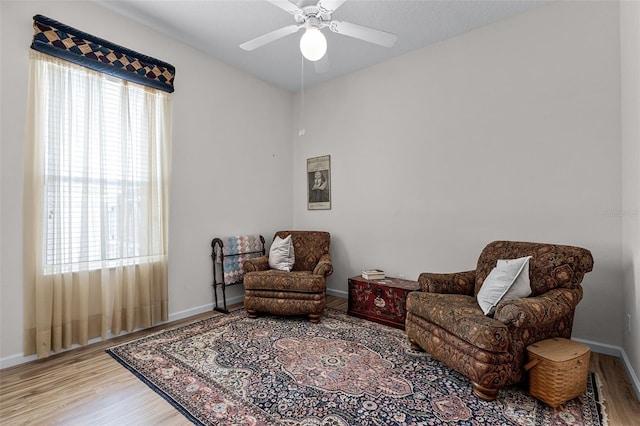 2026 Winding Oaks Dr, Orlando, FL 32825 - living area featuring wood finished floors, a ceiling fan, and baseboards