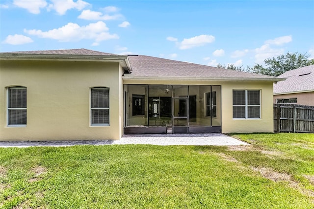 2026 Winding Oaks Dr, Orlando, FL 32825 - back of property featuring a sunroom, stucco siding, and roof with shingles