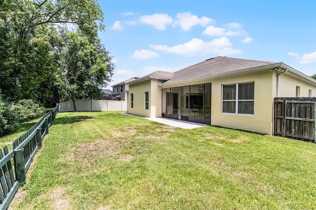 2026 Winding Oaks Dr, Orlando, FL 32825 - rear view of property with stucco siding, a sunroom, and a shingled roof