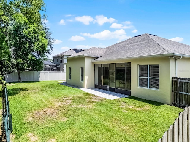 2026 Winding Oaks Dr, Orlando, FL 32825 - back of house featuring stucco siding and roof with shingles