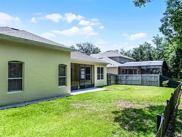2026 Winding Oaks Dr, Orlando, FL 32825 - view of yard with a sunroom
