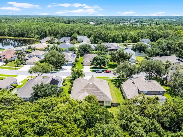 2026 Winding Oaks Dr, Orlando, FL 32825 - aerial perspective of suburban area with a forest and a large body of water