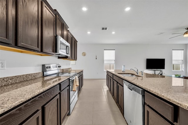 14325 Hidden Ct, Clermont, FL 34711 - kitchen featuring stainless steel appliances, a sink, a ceiling fan, plenty of natural light, and recessed lighting