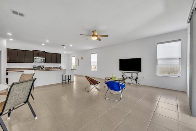 14325 Hidden Ct, Clermont, FL 34711 - living room featuring a ceiling fan, recessed lighting, and light tile patterned flooring