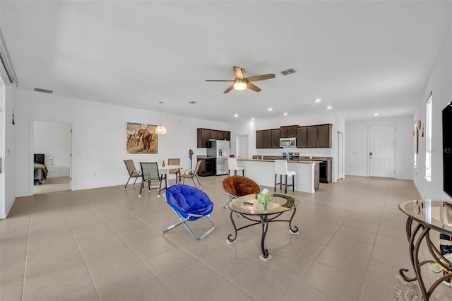 14325 Hidden Ct, Clermont, FL 34711 - living area featuring a ceiling fan, light tile patterned flooring, and recessed lighting