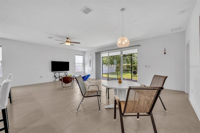 14325 Hidden Ct, Clermont, FL 34711 - dining room with light tile patterned flooring and a ceiling fan