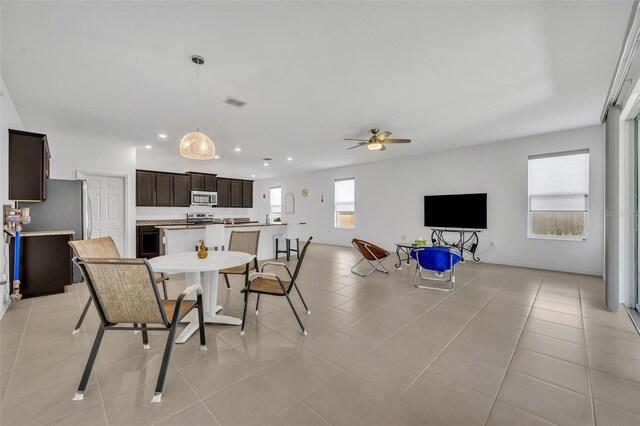 14325 Hidden Ct, Clermont, FL 34711 - dining area featuring ceiling fan, recessed lighting, and light tile patterned floors