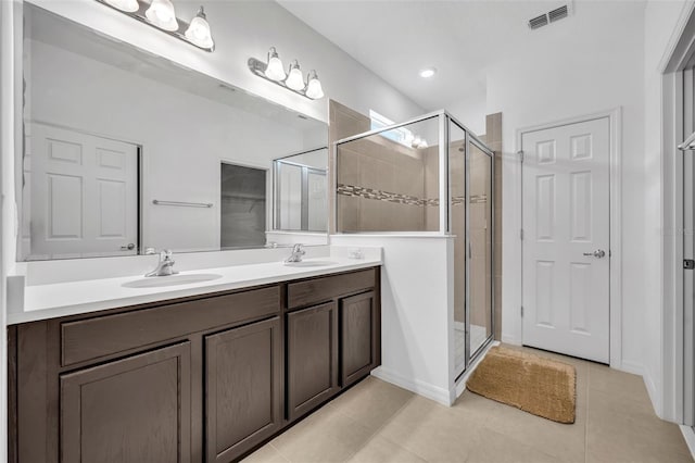 14325 Hidden Ct, Clermont, FL 34711 - bathroom featuring a stall shower, double vanity, and tile patterned flooring