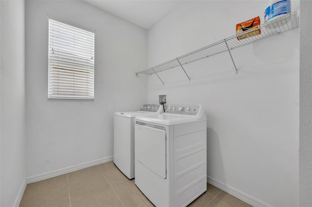 14325 Hidden Ct, Clermont, FL 34711 - laundry room with separate washer and dryer, baseboards, and light tile patterned floors