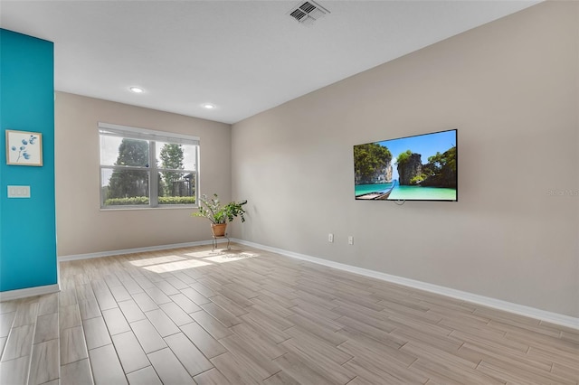 2936 Econ Landing Blvd, Orlando, FL 32825 - unfurnished room with baseboards, wood finish floors, and recessed lighting