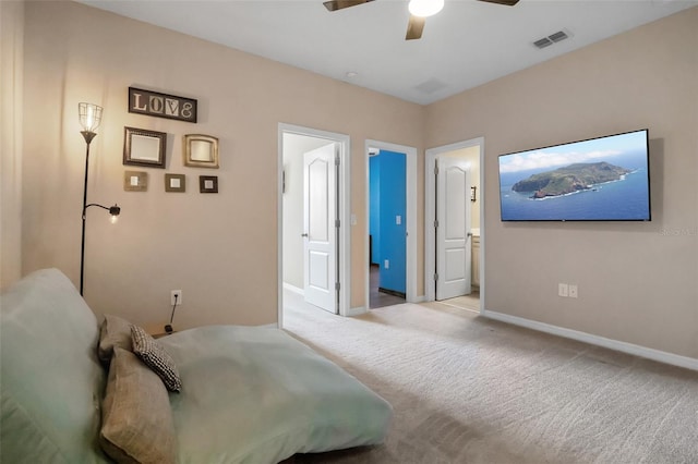 2936 Econ Landing Blvd, Orlando, FL 32825 - bedroom featuring baseboards, carpet, connected bathroom, and ceiling fan