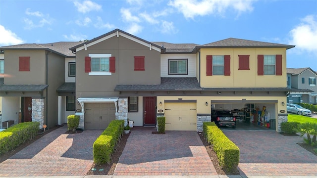 2936 Econ Landing Blvd, Orlando, FL 32825 - multi unit property with stucco siding, driveway, an attached garage, and stone siding