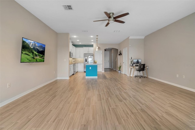 2936 Econ Landing Blvd, Orlando, FL 32825 - unfurnished living room with arched walkways, a ceiling fan, baseboards, light wood finished floors, and recessed lighting