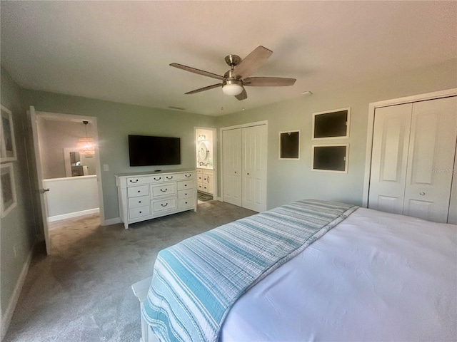 200 S Banana River Blvd Unit 703, Cocoa Beach, FL 32931 - bedroom with dark colored carpet, two closets, ceiling fan, and baseboards