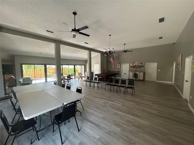 200 S Banana River Blvd Unit 703, Cocoa Beach, FL 32931 - dining space with ceiling fan, a textured ceiling, wood finished floors, and baseboards