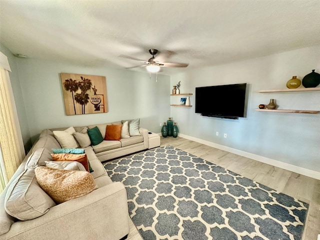 200 S Banana River Blvd Unit 703, Cocoa Beach, FL 32931 - living area featuring ceiling fan, wood finished floors, and baseboards
