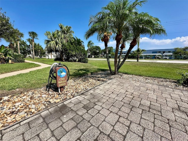 200 S Banana River Blvd Unit 703, Cocoa Beach, FL 32931 - view of community featuring a lawn