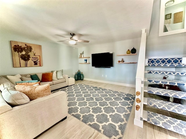 200 S Banana River Blvd Unit 703, Cocoa Beach, FL 32931 - living area featuring a ceiling fan, wood finished floors, and baseboards