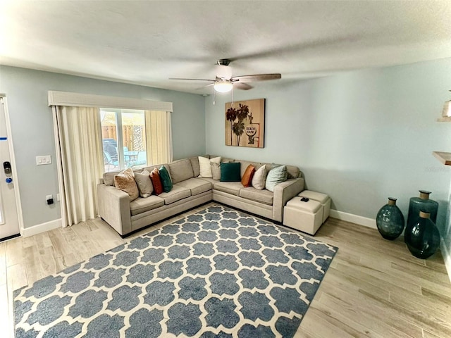 200 S Banana River Blvd Unit 703, Cocoa Beach, FL 32931 - living area featuring ceiling fan, wood finished floors, and baseboards
