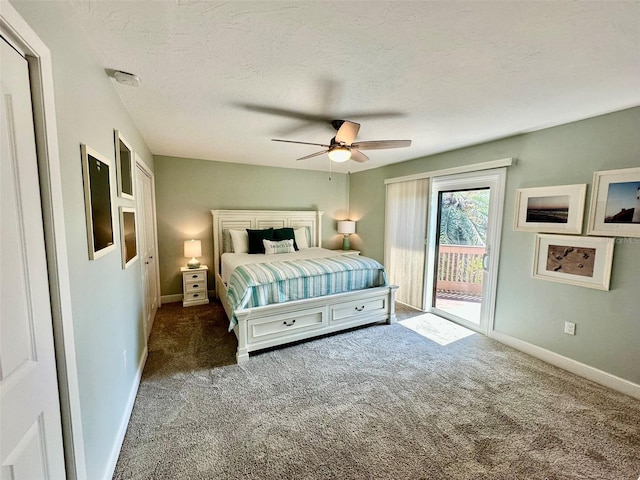 200 S Banana River Blvd Unit 703, Cocoa Beach, FL 32931 - carpeted bedroom featuring access to outside, baseboards, a textured ceiling, and a ceiling fan
