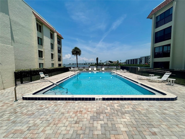 200 S Banana River Blvd Unit 703, Cocoa Beach, FL 32931 - community pool with a patio area