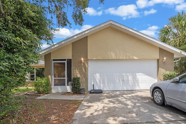3362 Partridge St, Deltona, FL 32738 - mid-century home with brick siding, concrete driveway, and an attached garage