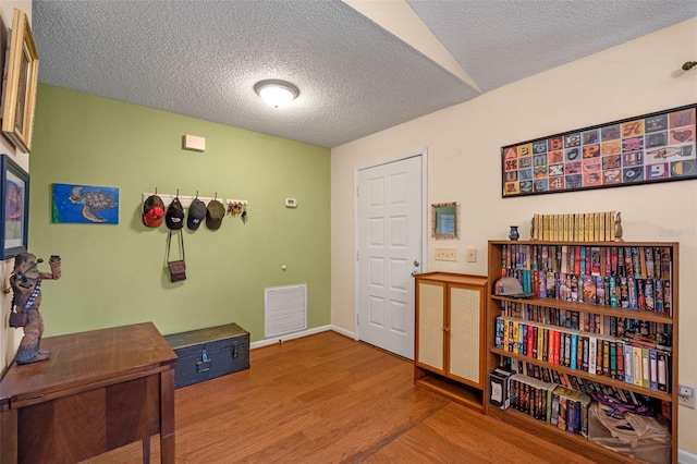 3362 Partridge St, Deltona, FL 32738 - misc room with wood finished floors, a textured ceiling, and baseboards