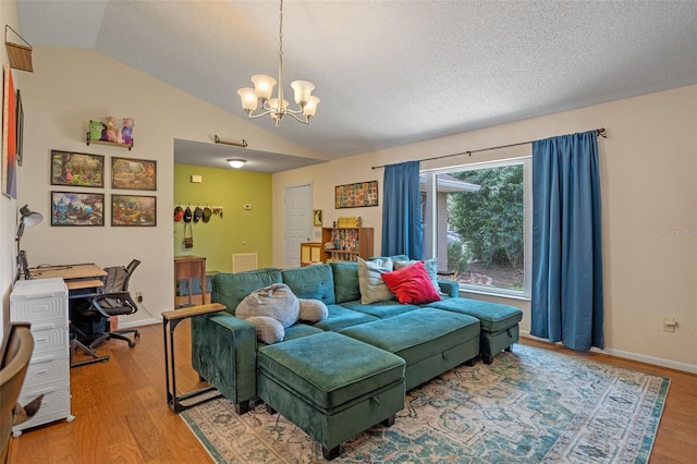 3362 Partridge St, Deltona, FL 32738 - living room with lofted ceiling, a chandelier, light wood-style floors, a desk, and a textured ceiling