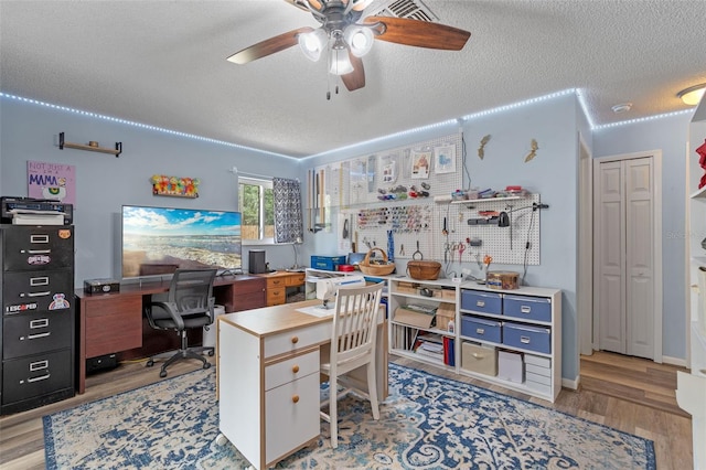 3362 Partridge St, Deltona, FL 32738 - office space with a textured ceiling, a ceiling fan, and light wood-style flooring