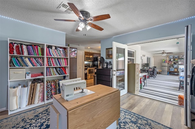 3362 Partridge St, Deltona, FL 32738 - office featuring ceiling fan, light wood finished floors, and a textured ceiling
