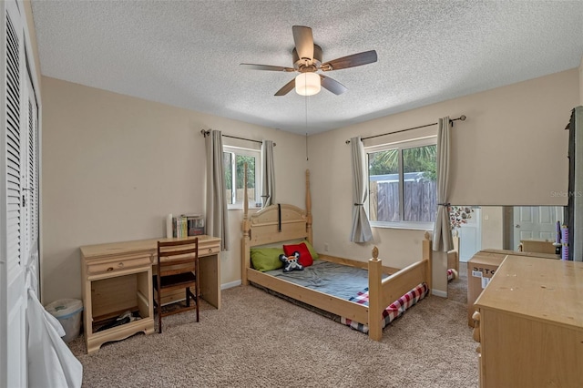 3362 Partridge St, Deltona, FL 32738 - bedroom with a textured ceiling, light colored carpet, a ceiling fan, and baseboards