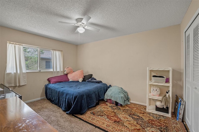 3362 Partridge St, Deltona, FL 32738 - carpeted bedroom with a closet, baseboards, a ceiling fan, and a textured ceiling