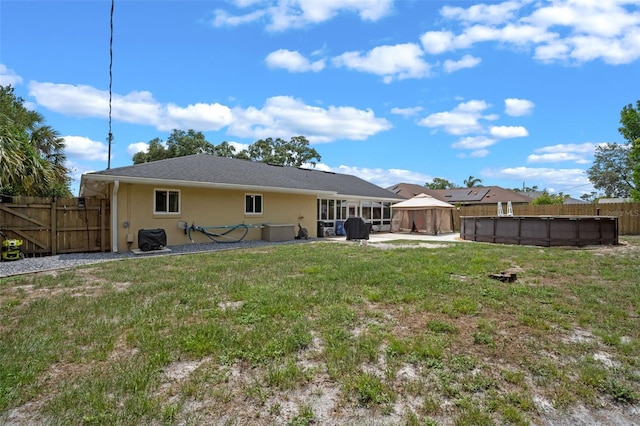 3362 Partridge St, Deltona, FL 32738 - back of house featuring stucco siding and a gazebo