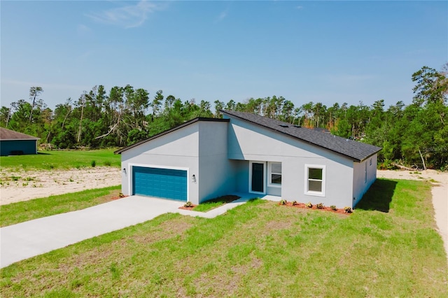 17434 SW 36th Avenue Rd, Ocala, FL 34473 - mid-century home featuring an attached garage, concrete driveway, a front lawn, and stucco siding