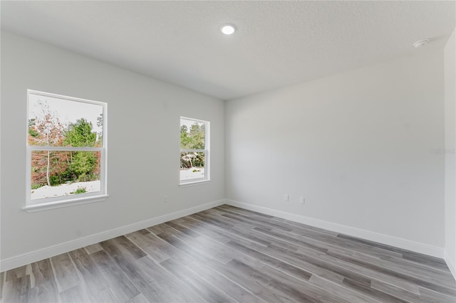 17434 SW 36th Avenue Rd, Ocala, FL 34473 - spare room with light wood-type flooring, baseboards, and recessed lighting
