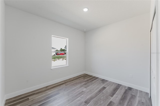 17434 SW 36th Avenue Rd, Ocala, FL 34473 - unfurnished room featuring wood finished floors and baseboards