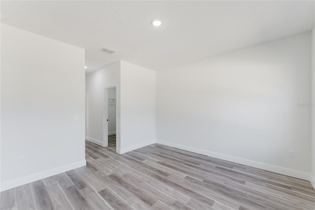 17434 SW 36th Avenue Rd, Ocala, FL 34473 - unfurnished room with light wood finished floors, baseboards, and recessed lighting