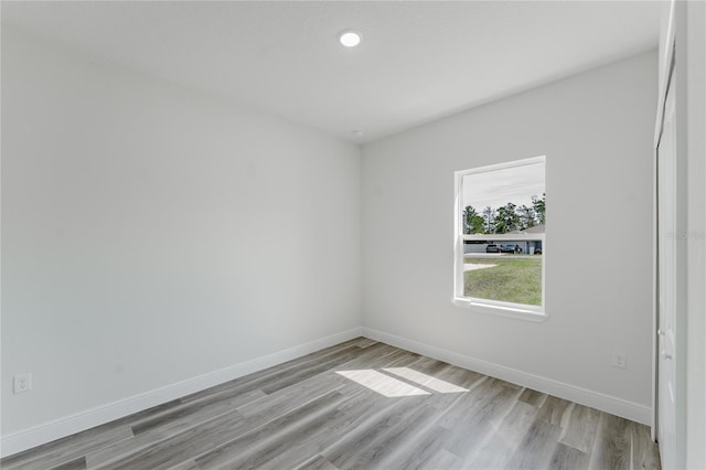 17434 SW 36th Avenue Rd, Ocala, FL 34473 - spare room featuring light wood-style floors, baseboards, and recessed lighting